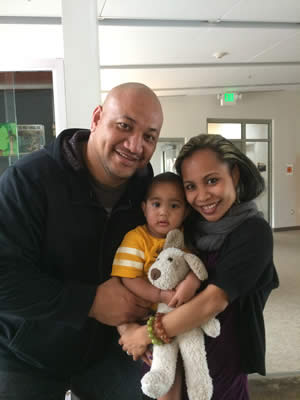 Family holding child.