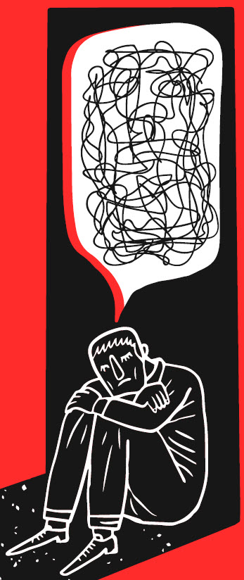 Mental Health - man crouching in dark corner.